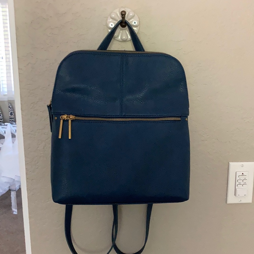 Blue back pack with zippers market and spruce